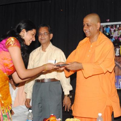 Swamiji Presenting Book To Student Of Bala Vidya Mandir