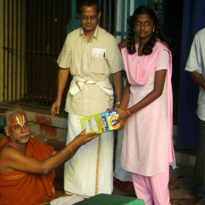 A Girl Student Receiving The Solar Lantern