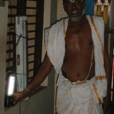 Temple Priest Displays The Solar Lantern