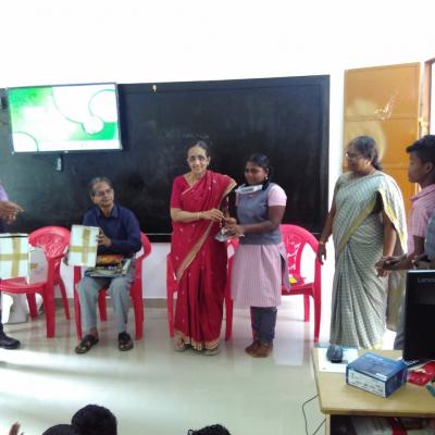 Nalini Parthasarathy Presenting Solar Lamp To A Student