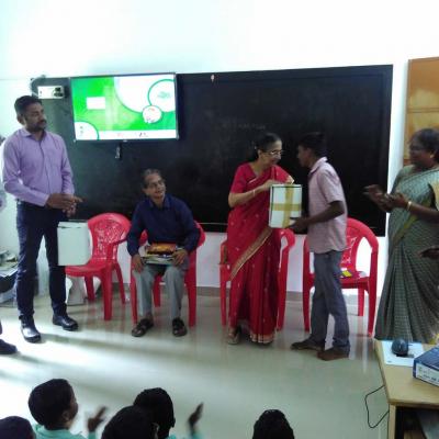 Solar Lamp Being Presented To A Boy Student