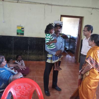 With Mr Samson Tn Poilice Holding A Handicapped Child
